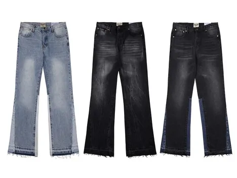 Three pairs of flared jeans laid flat in light blue, black and washed grey