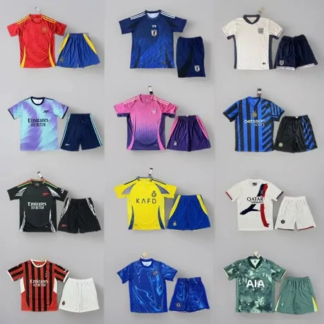 Football kits with shirts and shorts in red, blue, white, yellow and green laid out in a grid